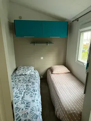 Un ou plusieurs lits dans un hébergement de l'établissement Mobilhome Mag Ced les Dunes de contis Piscines et Plage