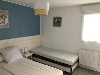 Un ou plusieurs lits dans un hébergement de l'établissement Charmante maisonette