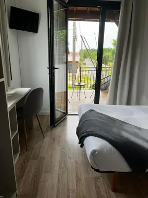 Un ou plusieurs lits dans un hébergement de l'établissement Hotel Cote et Lac