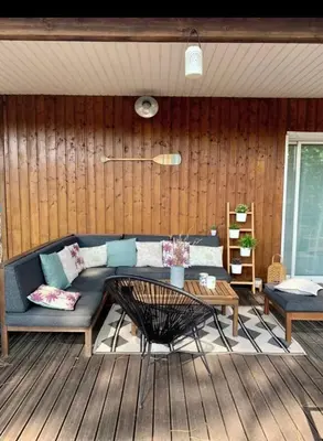Coin salon dans l'établissement Jolie maison de vacances proche lac
