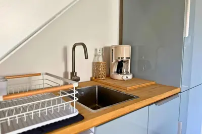 Cuisine ou kitchenette dans l'établissement Le Cottage Détente