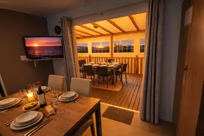 Télévision ou salle de divertissement dans l'établissement Mobilhome Le Serenité - La Plage