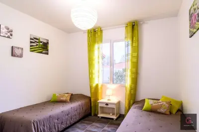 Un ou plusieurs lits dans un hébergement de l'établissement Biscarrosse Bourg Maison tout confort proche du centre ville