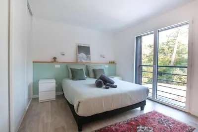 Un ou plusieurs lits dans un hébergement de l'établissement La Villa Canopée du Lac