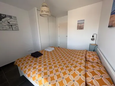 Un ou plusieurs lits dans un hébergement de l'établissement Appartement Côté Dune à 600m de l'Océan