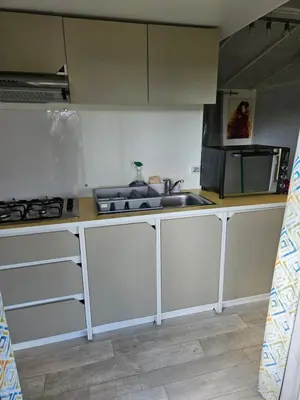 Cuisine ou kitchenette dans l'établissement Camping familial les Chalets d'Uza