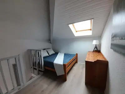 Un ou plusieurs lits dans un hébergement de l'établissement Studio Duplex Moliets
