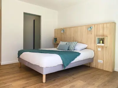 Un ou plusieurs lits dans un hébergement de l'établissement Appartement Aqua-Villas Lake And Sea
