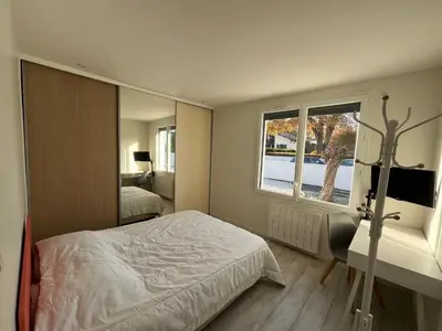 Un ou plusieurs lits dans un hébergement de l'établissement Maison famille avec piscine, Wi-Fi et parking à Gujan-Mestras - FR-1-319-583