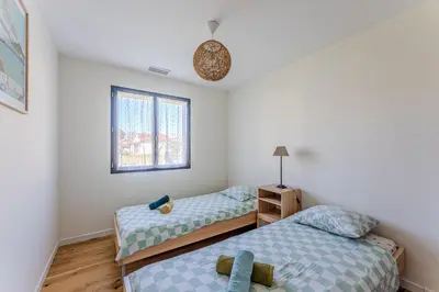 Un ou plusieurs lits dans un hébergement de l'établissement Villa Coco 3 chambres