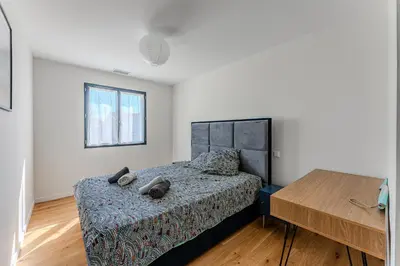 Un ou plusieurs lits dans un hébergement de l'établissement Villa Coco 3 chambres