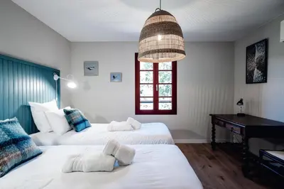 Un ou plusieurs lits dans un hébergement de l'établissement Maison Bleue Ouest
