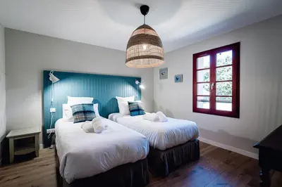 Un ou plusieurs lits dans un hébergement de l'établissement Maison Bleue Ouest