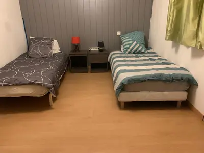 Un ou plusieurs lits dans un hébergement de l'établissement Chambre de détente