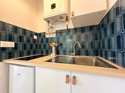 Cuisine ou kitchenette dans l'établissement Le Sunset Beach - Parking - Fibre - Parc - Centre