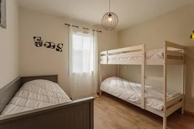 Un ou plusieurs lits dans un hébergement de l'établissement Villa Kaino 1 - Climatisée avec jardin