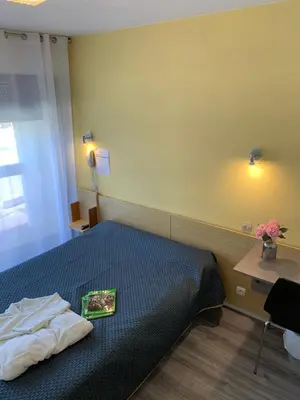 Un ou plusieurs lits dans un hébergement de l'établissement Hotel Bains Sarrailh