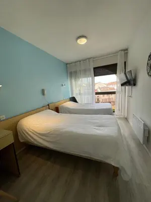 Un ou plusieurs lits dans un hébergement de l'établissement Hotel Bains Sarrailh