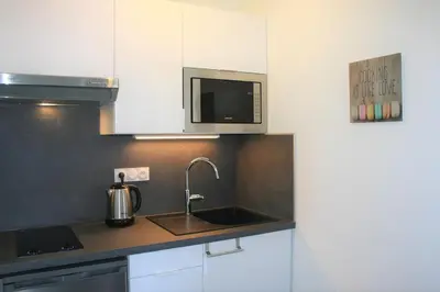 Cuisine ou kitchenette dans l'établissement Ambiance Cosy Capbreton