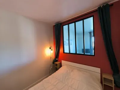 Un ou plusieurs lits dans un hébergement de l'établissement Appartement Mimizan Plage
