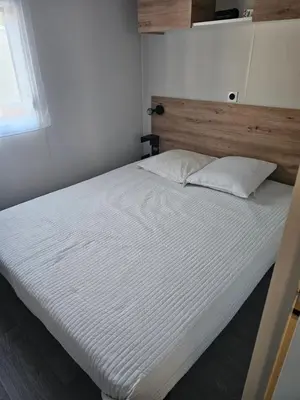 Un ou plusieurs lits dans un hébergement de l'établissement Mobilehome cosy