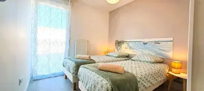Un ou plusieurs lits dans un hébergement de l'établissement L'air du large superbe T3 lumineux avec jardin