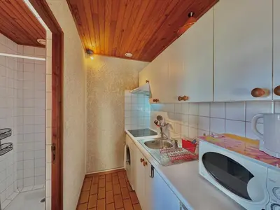 Cuisine ou kitchenette dans l'établissement Rouge Gorge - Studio à 500m des plages