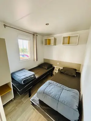Un ou plusieurs lits dans un hébergement de l'établissement Le 510 mobil-home
