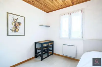 Un ou plusieurs lits dans un hébergement de l'établissement Maison de Vacances à Biscarrosse – Proche du Lac de Latécoère 5 personnes