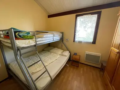 Un ou plusieurs lits dans un hébergement de l'établissement Villa patio proche du port