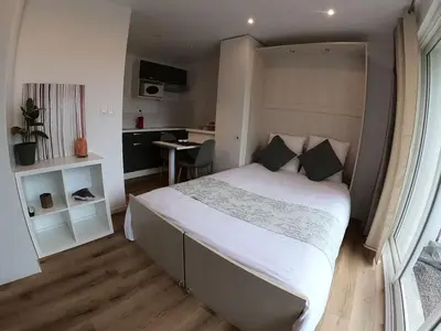 Un ou plusieurs lits dans un hébergement de l'établissement La villa baie du lac les pins