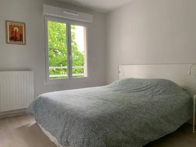 Un ou plusieurs lits dans un hébergement de l'établissement Appartement Gujan Mestras premier étage