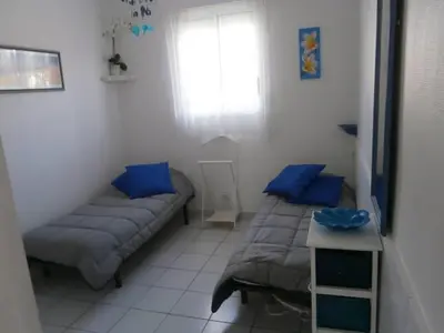 Un ou plusieurs lits dans un hébergement de l'établissement APPART BISCA plage