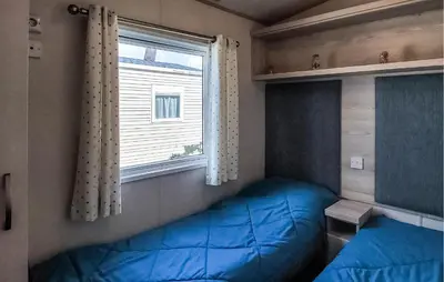 Un ou plusieurs lits dans un hébergement de l'établissement Beautiful Stacaravan