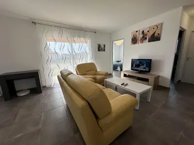 Télévision ou salle de divertissement dans l'établissement Capcos
