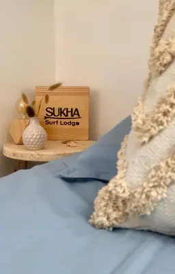 Un ou plusieurs lits dans un hébergement de l'établissement Sukha surf lodge