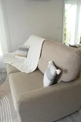 Coin salon dans l'établissement Petite maison de plain-pied
