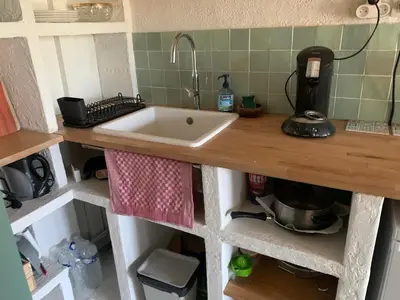 Cuisine ou kitchenette dans l'établissement Appartement 300m de la plage
