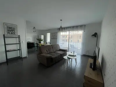 Coin salon dans l'établissement Appartement T3 Curistes