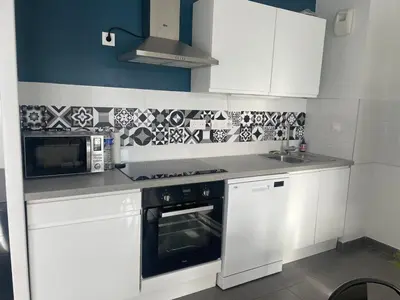 Cuisine ou kitchenette dans l'établissement Appartement T3 Curistes