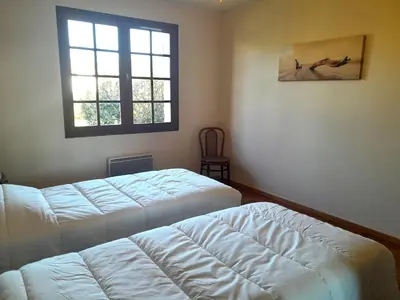 Un ou plusieurs lits dans un hébergement de l'établissement Maison charmante près de l'océan à Lit-et-Mixe - FR-1-50-170