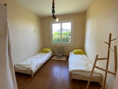 Un ou plusieurs lits dans un hébergement de l'établissement Maison au calme à Gujan Mestras