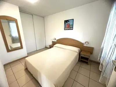 Un ou plusieurs lits dans un hébergement de l'établissement Appartement plage, piscine, tennis, nature