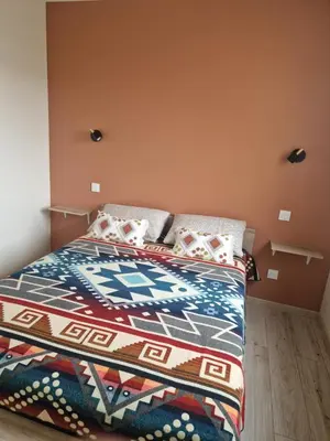 Un ou plusieurs lits dans un hébergement de l'établissement Appartement des Aubépines