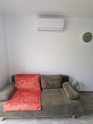 Coin salon dans l'établissement Appartement des Aubépines