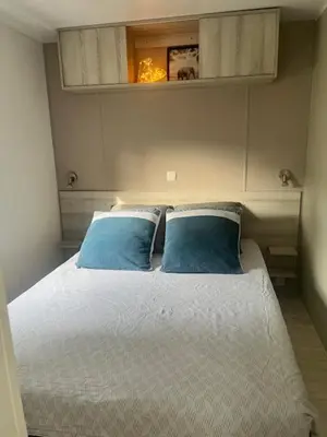 Un ou plusieurs lits dans un hébergement de l'établissement Mobil Home