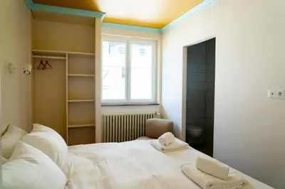 Un ou plusieurs lits dans un hébergement de l'établissement Hotel Bleu Soleil
