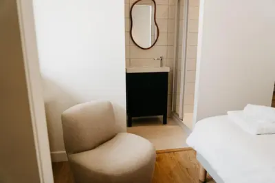 Un ou plusieurs lits dans un hébergement de l'établissement Hotel Bleu Soleil