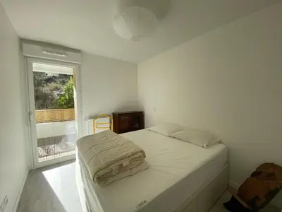 Un ou plusieurs lits dans un hébergement de l'établissement Appartement cosy proche centre Capbreton, situé dans un cadre boisé