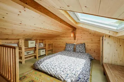 Un ou plusieurs lits dans un hébergement de l'établissement Nitedo- Maison avec jardin et terrasse - 200m plage et forêt